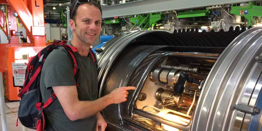 Mr Anderson pointing at the proton tubes